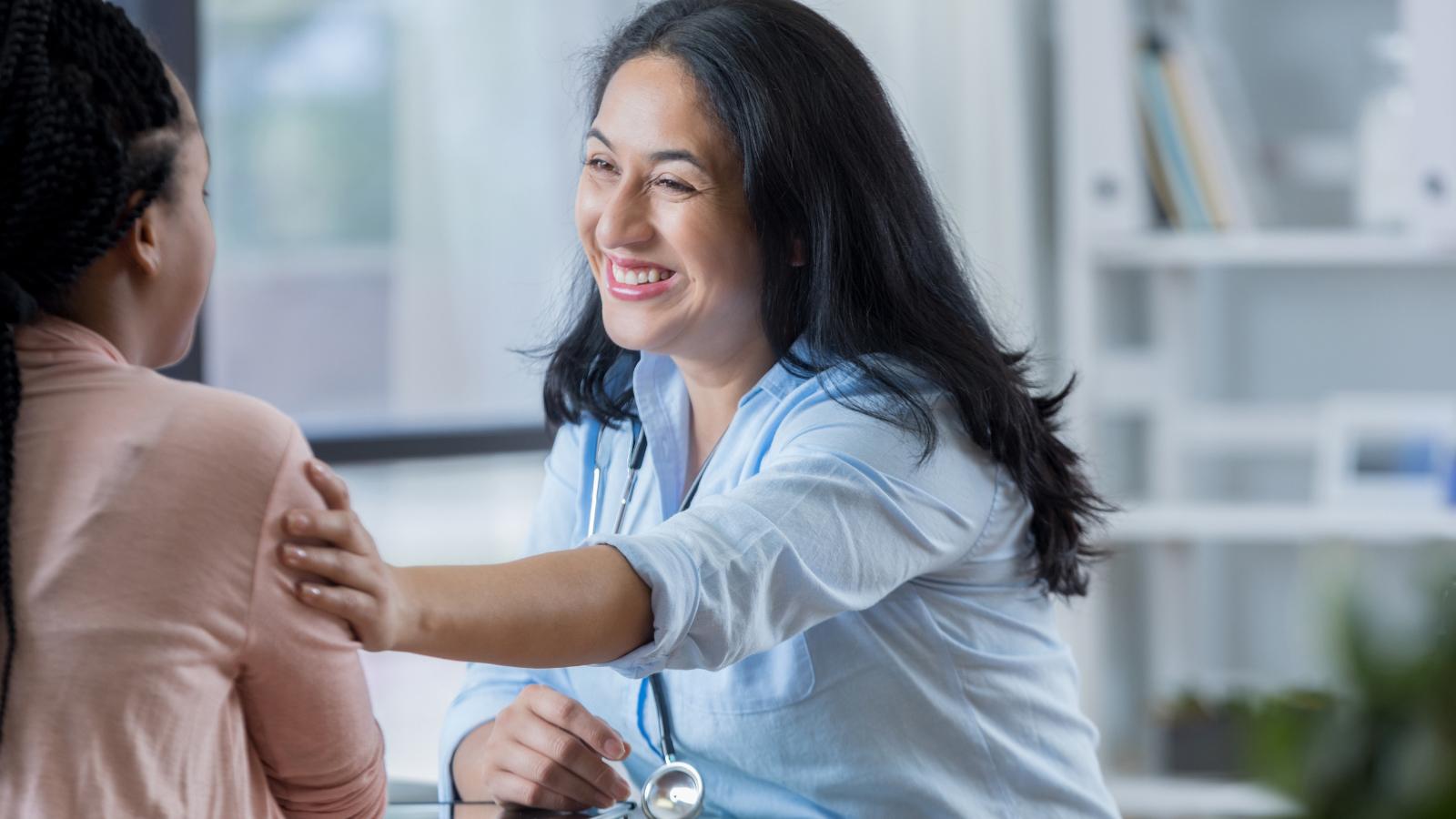 Caring person reassuring another